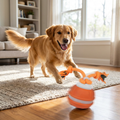 Sturdy dog play ball with motion sensor and tug rope