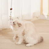 Hanging treat-dispensing cat toy