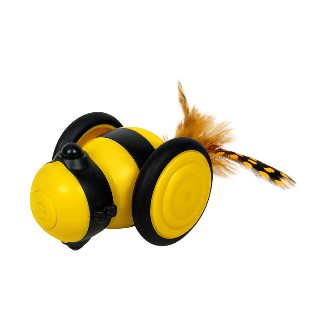 Cat chasing the bee toy