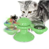 Cat playing with the spinning windmill toy