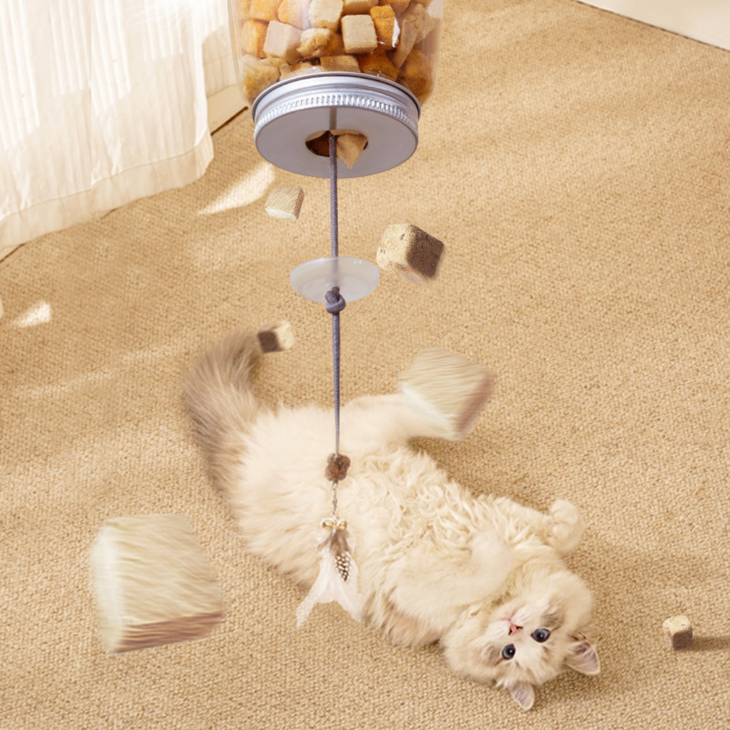 Hanging treat toy refill opening
