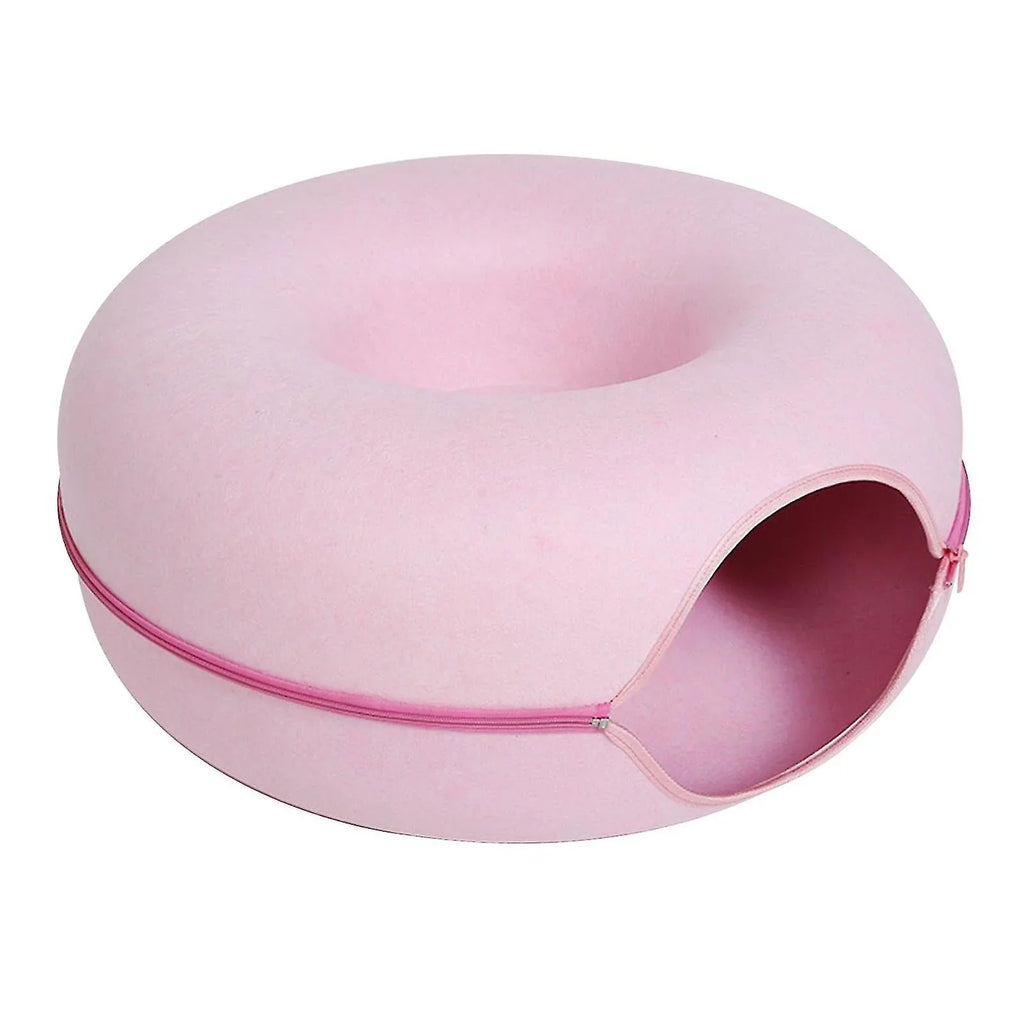 Cat curled up asleep in the PurrNest donut bed