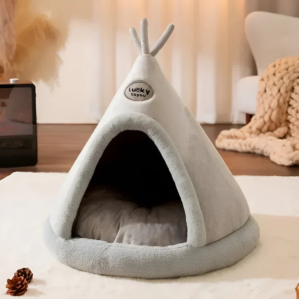 Cat resting inside the PurrTent cat house