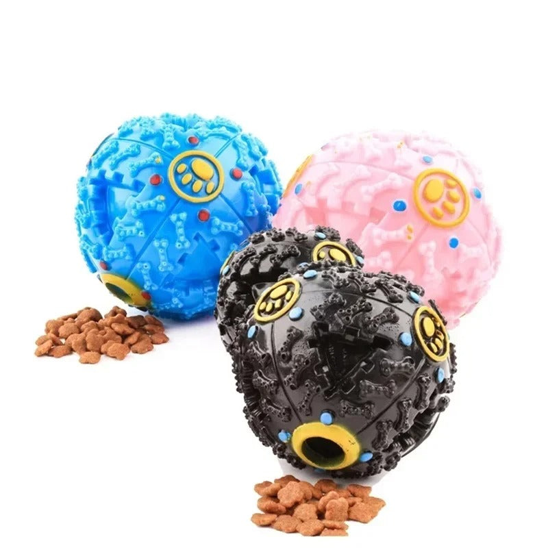 Dog rolling the treat dispensing ball