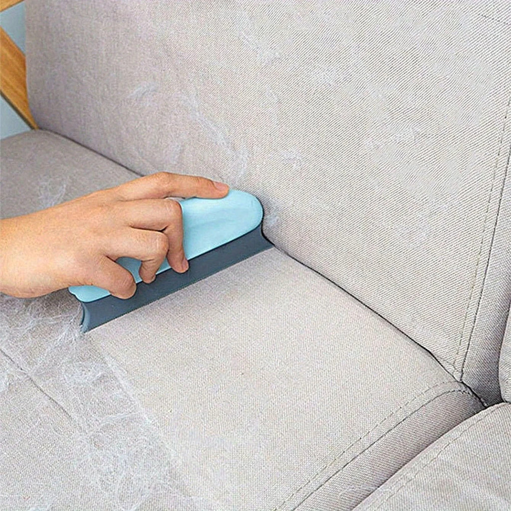Reusable Pet Hair-Pro brush being tapped clean