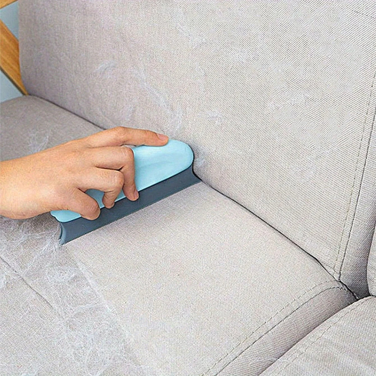 Reusable Pet Hair-Pro brush being tapped clean