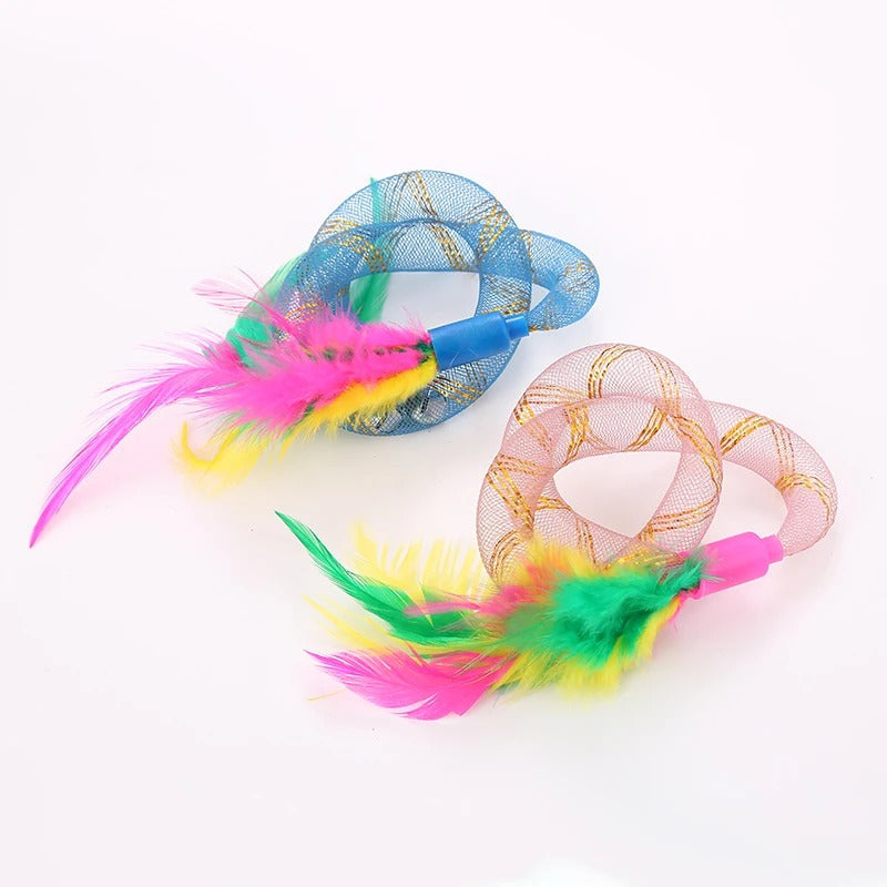 Cat swiping at the fluttering string tubing toy