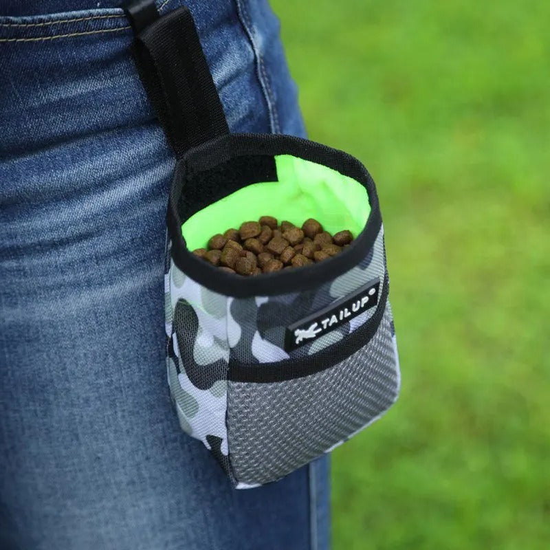 Treat pouch worn on a belt during a walk