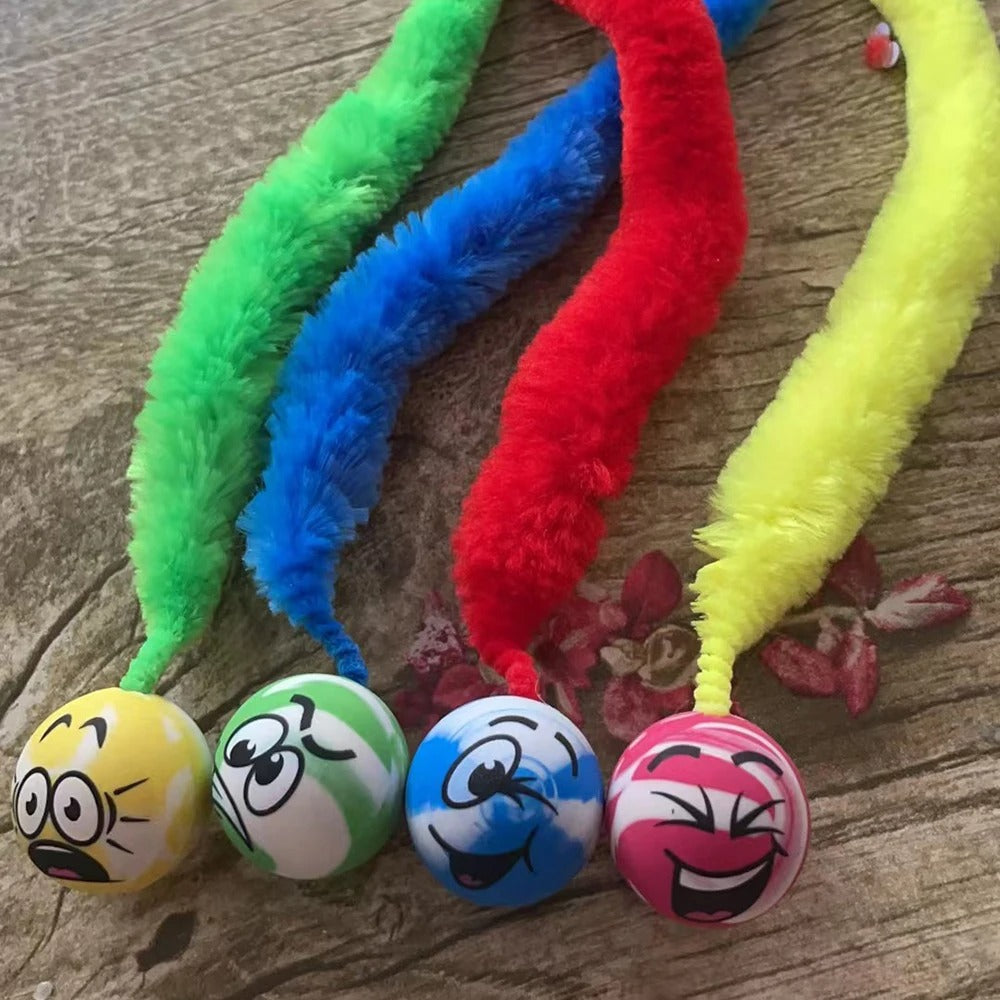 Cat chasing the tickle ball toy