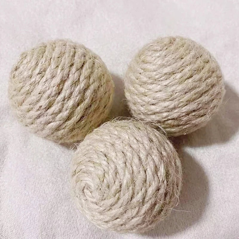 Cat batting a sisal sound ball