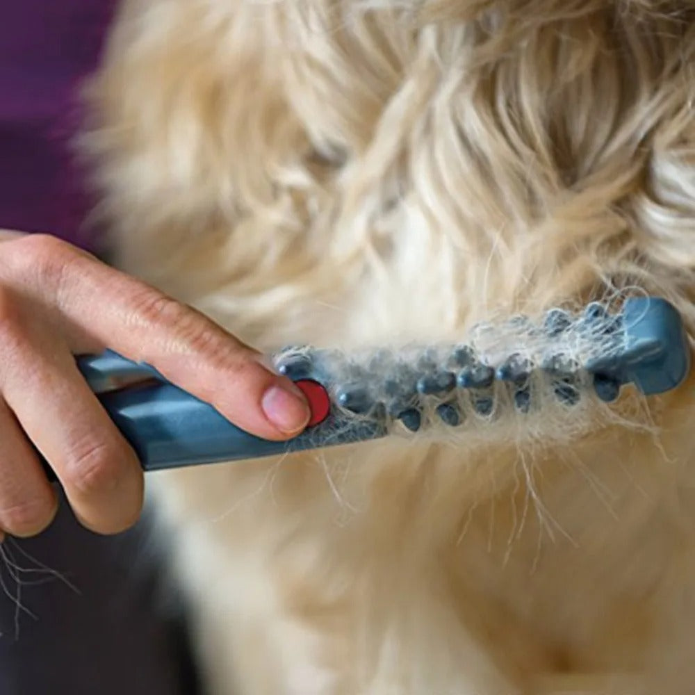 FurMaster trimmer grooming a cat quietly