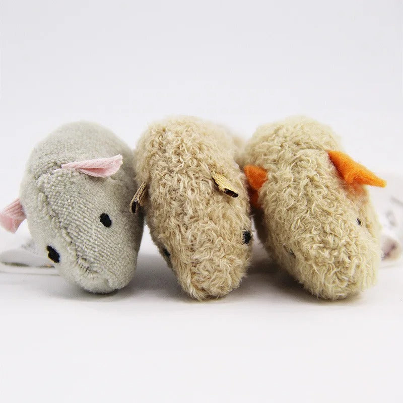 Cat pouncing on the plush mouse toy