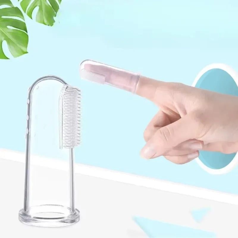 Finger toothbrush worn on a finger to brush a dog's teeth