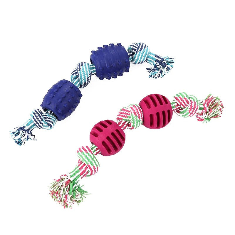 Dog tugging on the cotton rope toy with ball
