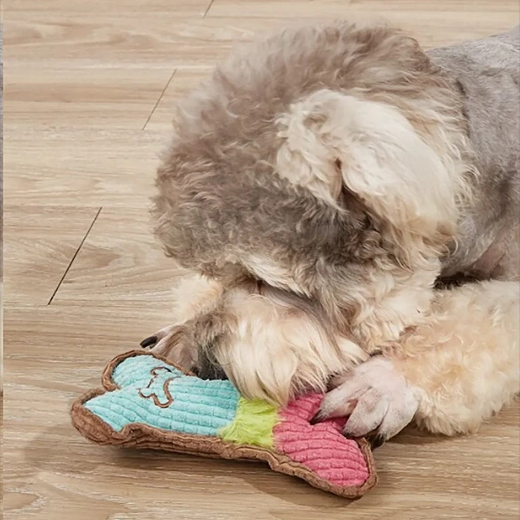 Plush bone dog toy in pink and white