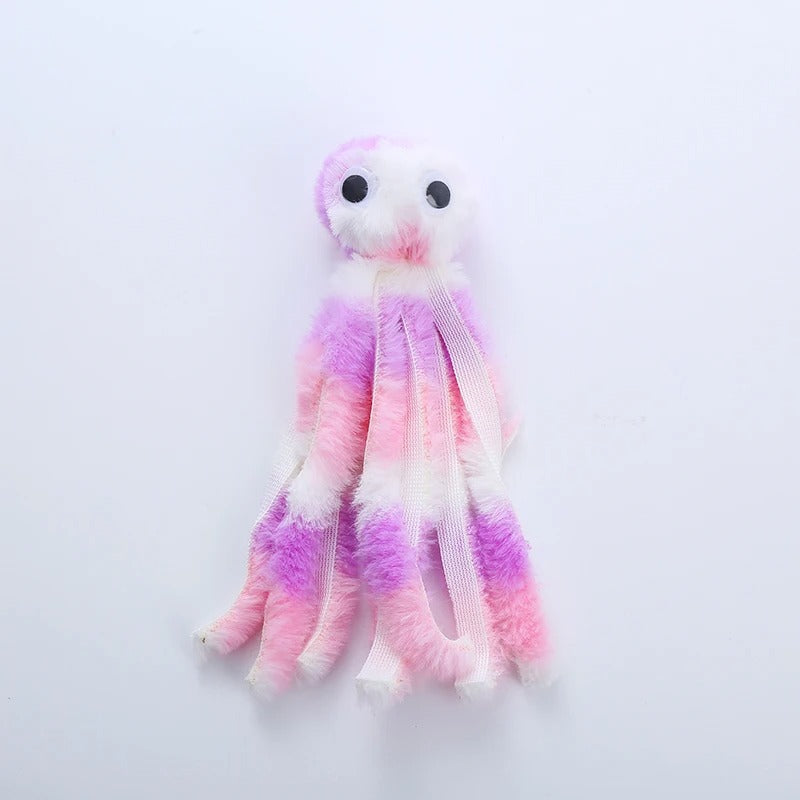 Cat wrestling with the octopus plush toy