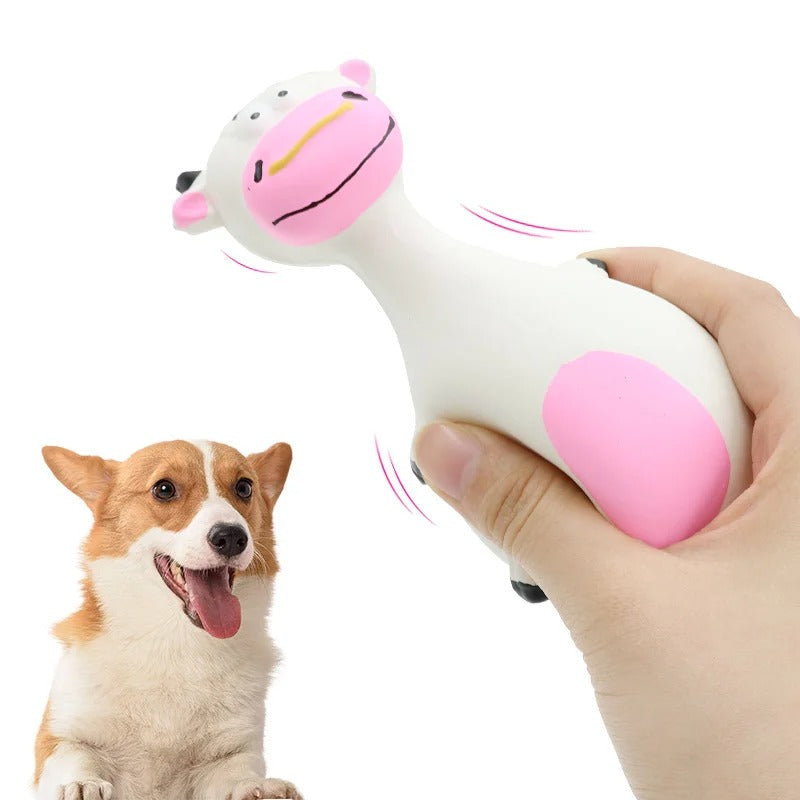 Puppy playing with the squeaky animal toy