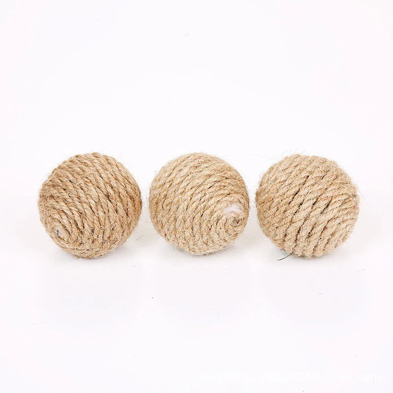 Kitten playing with a sisal sound ball