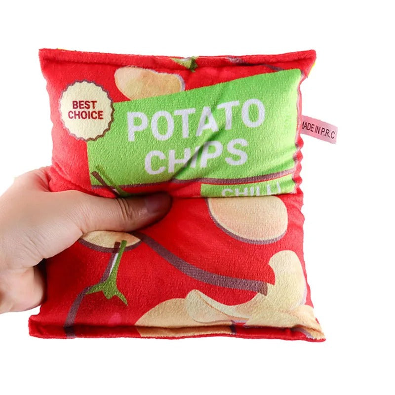 Dog tugging on the crinkle chips plush toy