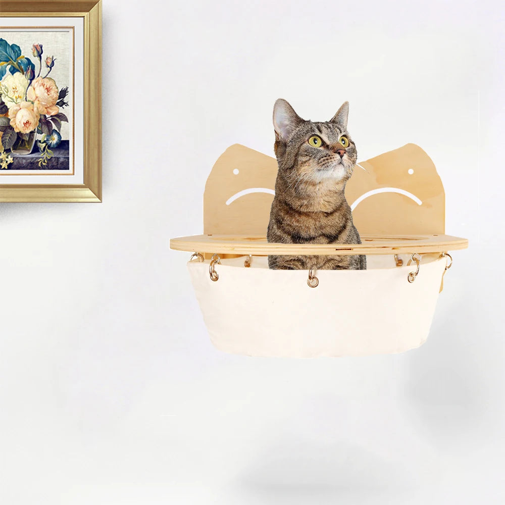 Cat resting in the wooden wall hammock